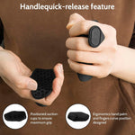 Person holding a black quick-release handle with ergonomic design and suction cups.