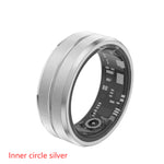 Silver electronic ring with visible circuitry on a white background