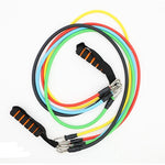 Set of colorful resistance bands with handles on a white background