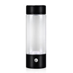 Clear glass bottle with black lid and base on a white background
