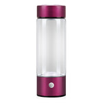 Clear glass bottle with a purple metallic base and cap on a white background