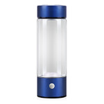 Clear glass bottle with blue accents on a white background